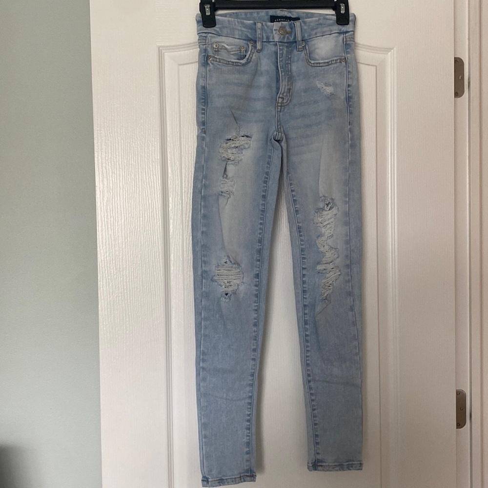 Light blue skinny jeans with rips